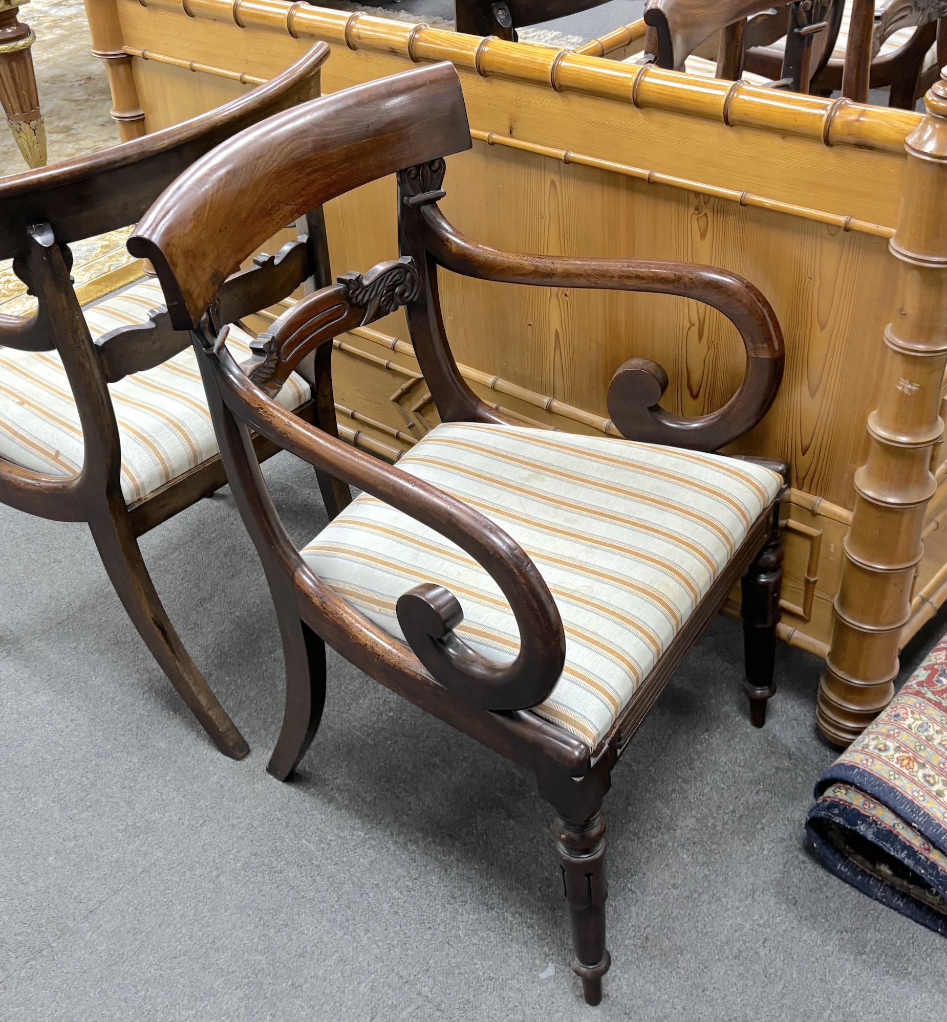 A set of eight William IV mahogany dining chairs, two with arms